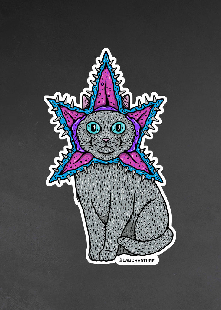 Photo of a vinyl sticker featuring a cat dressed as a demogorgon from Stranger Things on Netflix