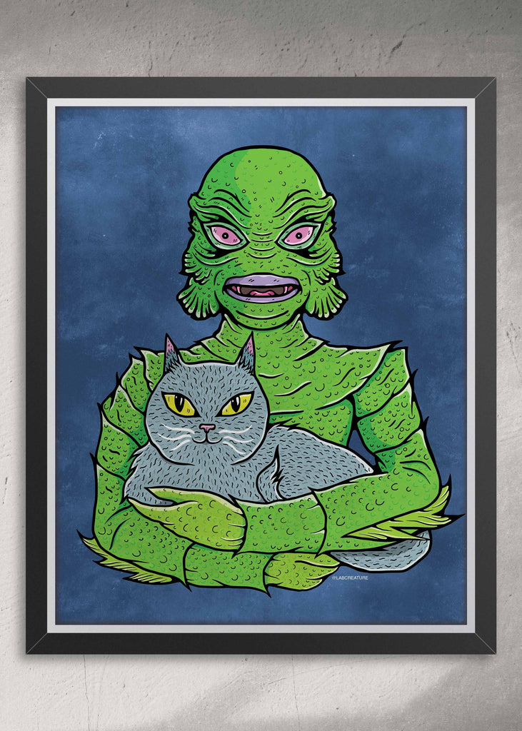 Framed illustration of The Creature from the Black Lagoon holding a grey cat with a blue background